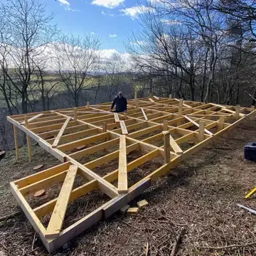 Decking foundations installed on a sloping garden